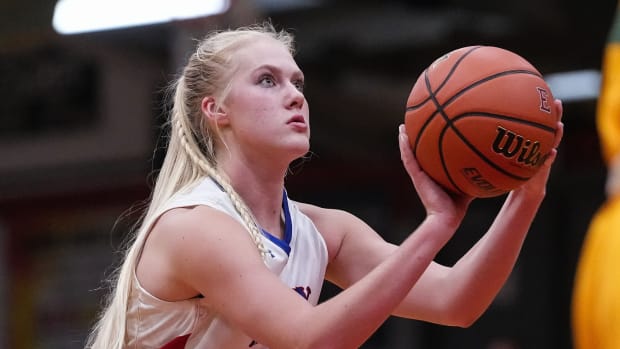 Indian Creek's Faith Wiseman (21) prepares to shoot to the ball Thursday, Nov 17, 2022 at Edinburgh High School in Edinburgh. Indian Creek defeated the Greenwood Woodmen, 38-19.